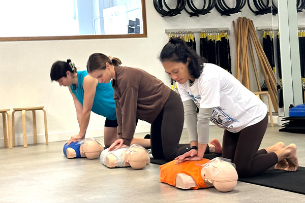 Group performing CPR at their workplace in Perth.