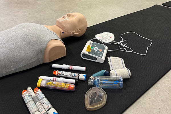 Onsite First Aid Course Perth equipment - manikin, AED, bandages, EpiPen