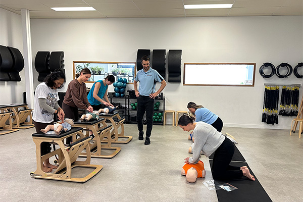 Performing CPR refresher course - onsite at pilates studio workplace